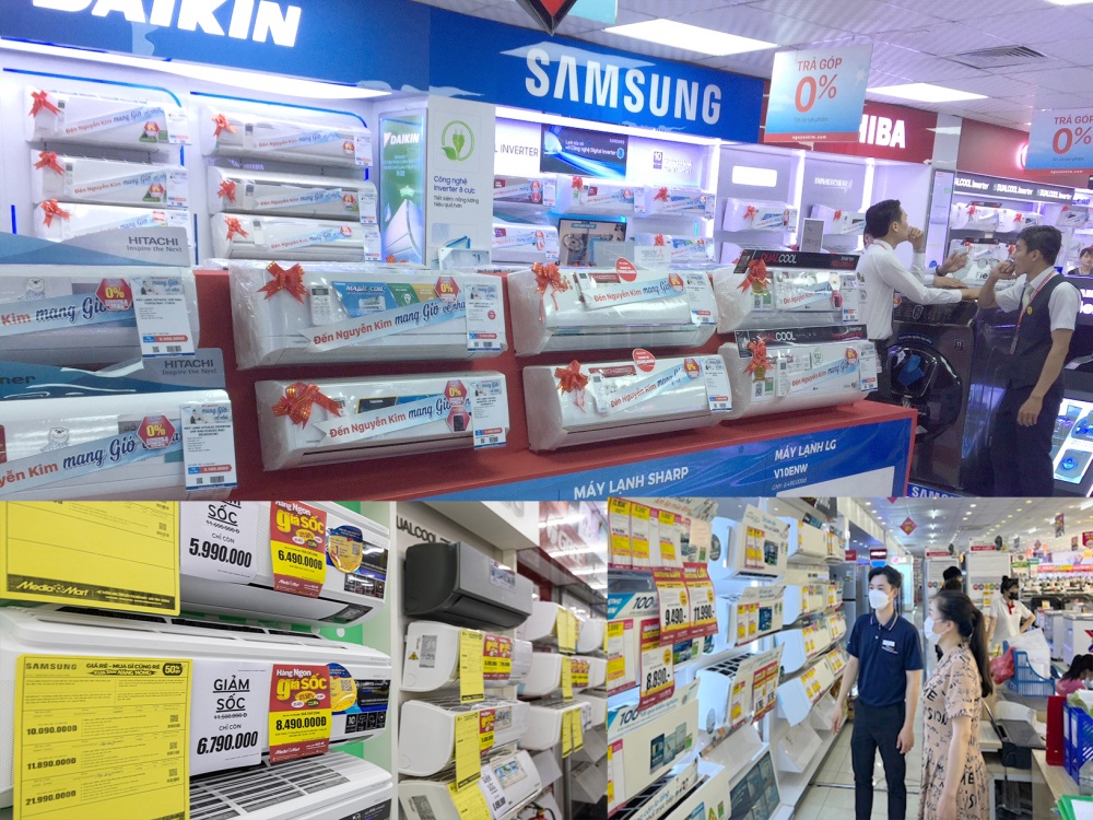 Nhân viên Siêu thị điện máy Chợ Lớn tư vấn cho khách hàng những dòng sản phẩm máy điều hòa có khuyến mãi sâu vào mùa nắng nóng